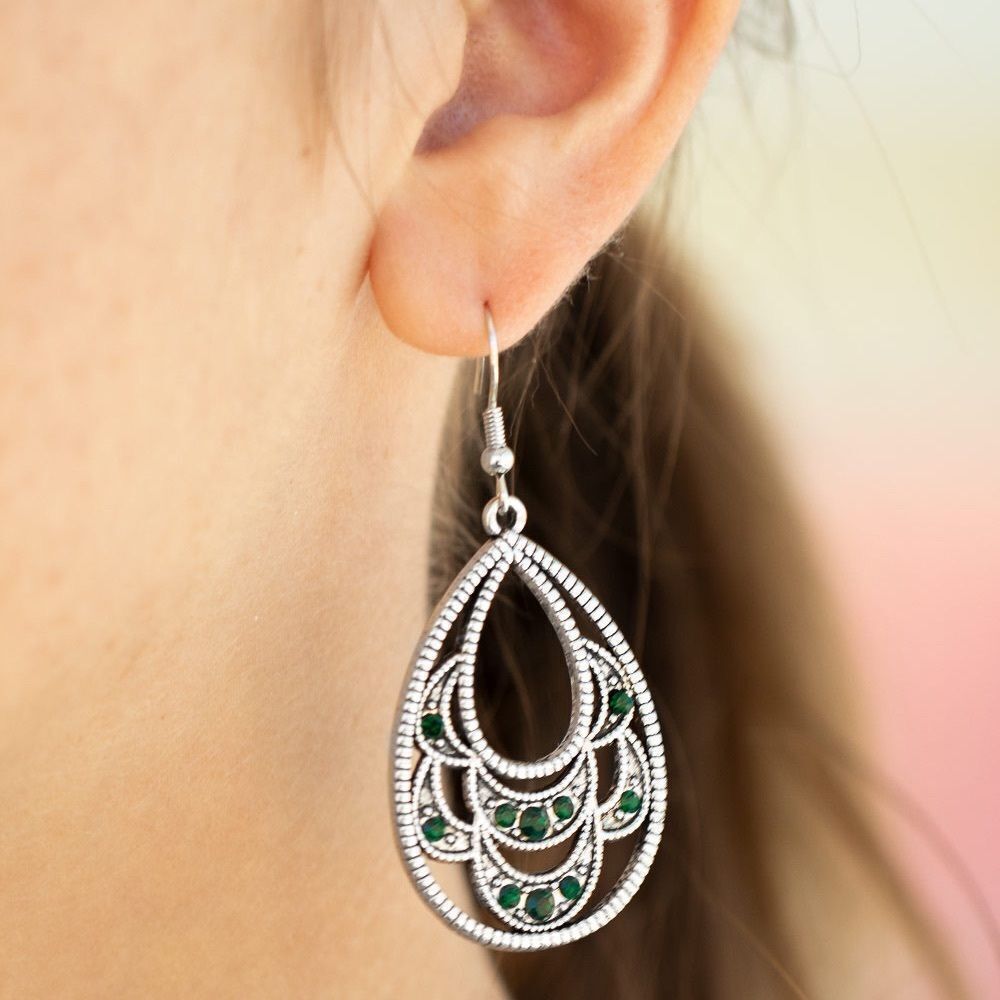 Silver tear drop earrings with emerald green rhinestones